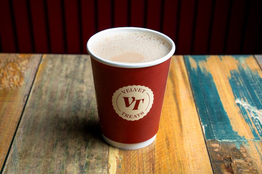 Creamy slow-brewed karak tea in a Velvet Treats cup