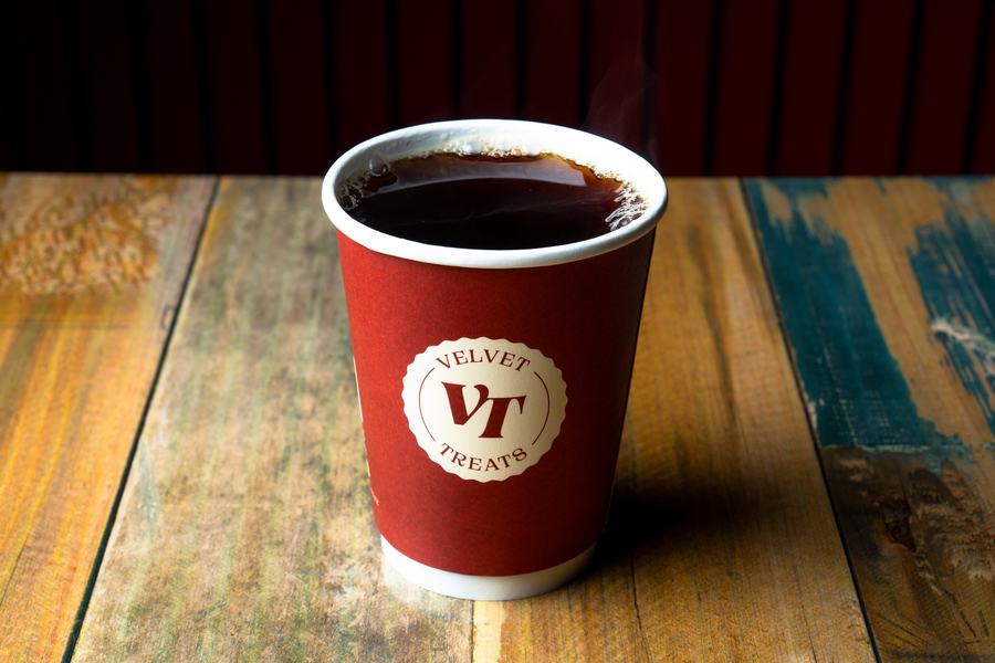 Freshly brewed coffee in a Velvet Treats cup